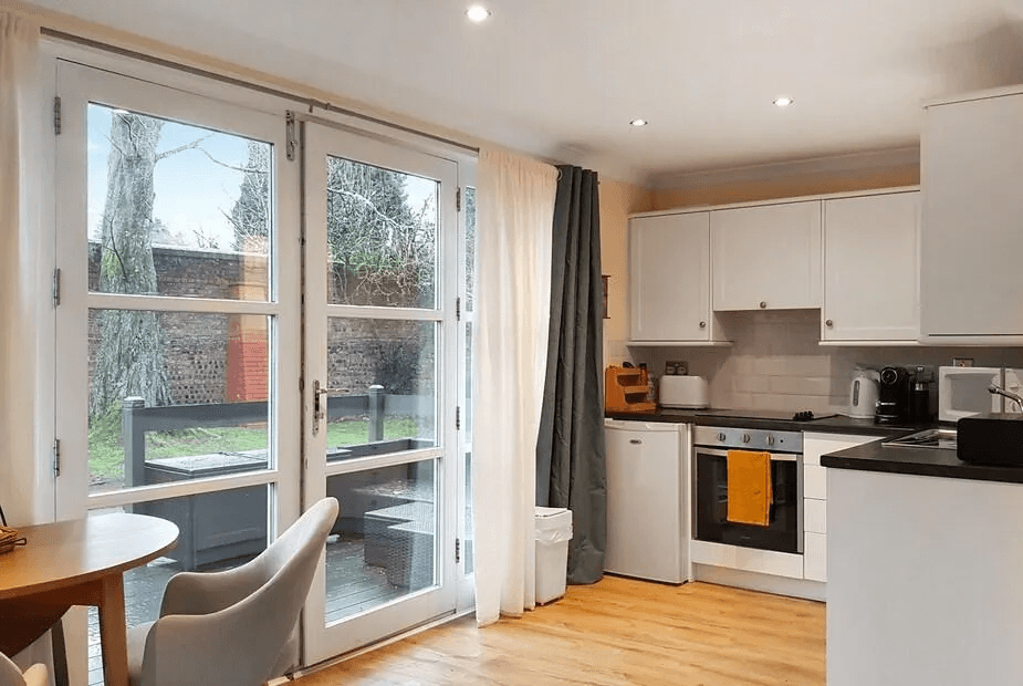 Leven Lodge 1 open-plan kitchen with French doors out to the garden
