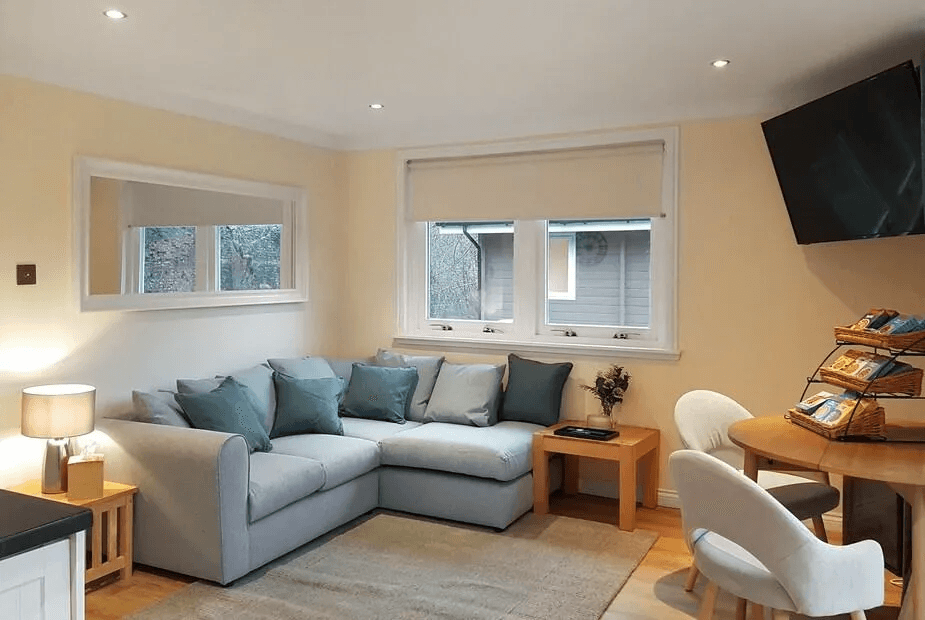 Corner sofa and dining table inside Leven Lodge 1, Alexandria